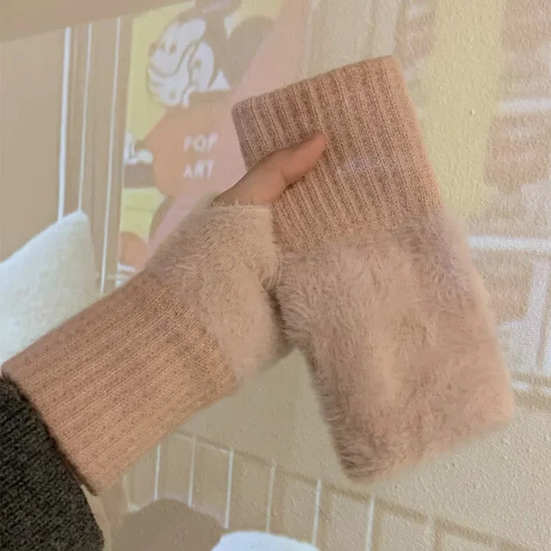 Pink fuzzy fingerless gloves with ribbed cuffs