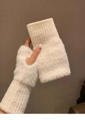 White fuzzy fingerless gloves with ribbed wrists and plush hand sections