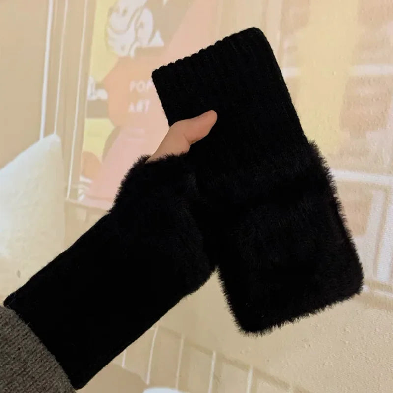 Black fuzzy fingerless gloves with ribbed cuffs