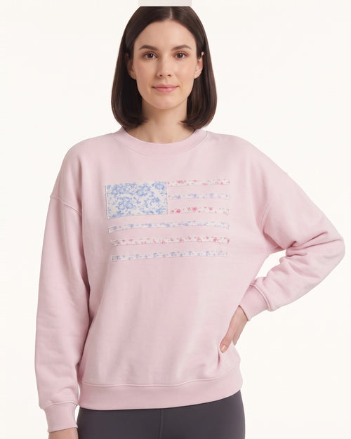 Light pink crewneck sweatshirt with floral American flag stripes graphic, relaxed fit