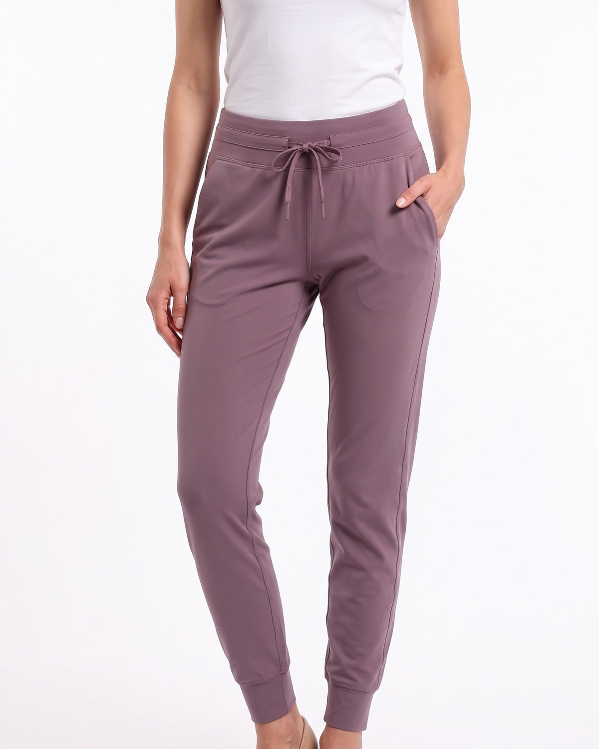 Women’s mauve slim-fit performance jogger pants with drawstring waist and ankle cuffs