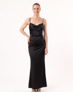 Black satin maxi slip dress with thin straps and cowl neckline, sleek fitted drape.