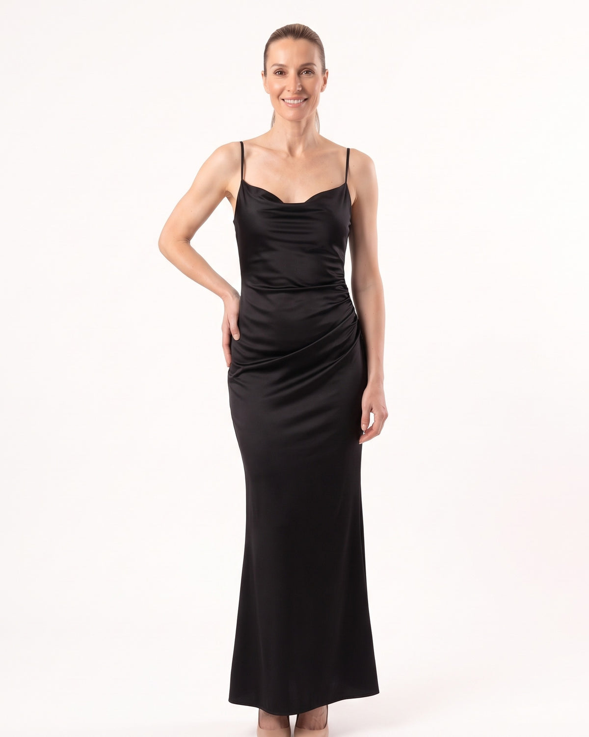 Black satin maxi slip dress with thin straps and cowl neckline, sleek fitted drape.