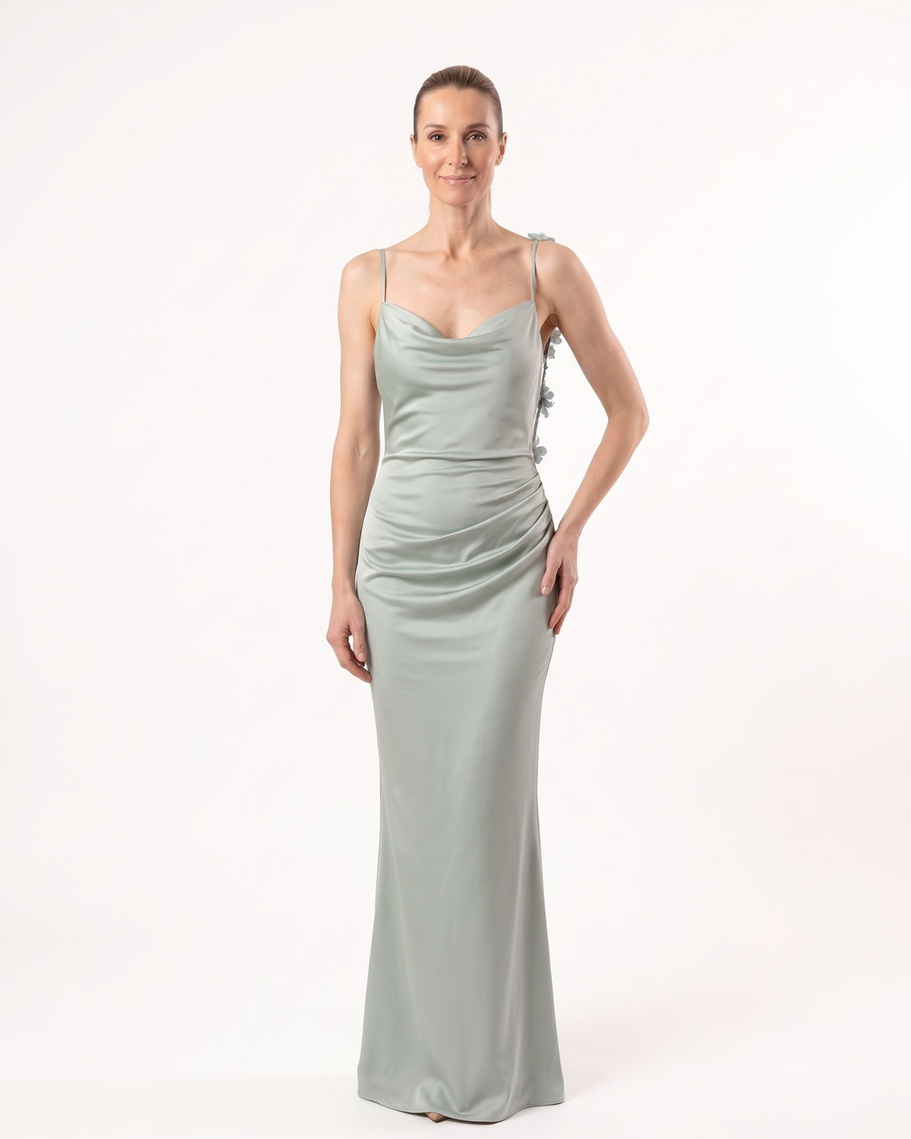 Light green satin maxi slip dress with thin straps and cowl neckline, smooth fitted fit.