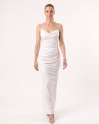 White satin maxi dress with thin straps and cowl neckline, fitted slip silhouette.