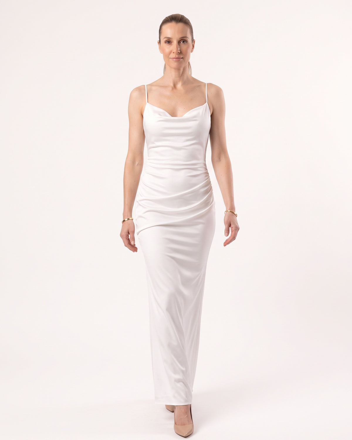 White satin maxi dress with thin straps and cowl neckline, fitted slip silhouette.