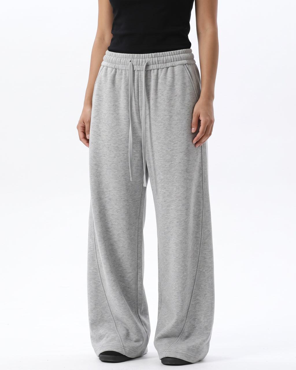 Women's light gray wide-leg sweatpants with drawstring waist and relaxed drape