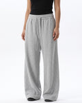 Women's light gray wide-leg sweatpants with drawstring waist and relaxed drape