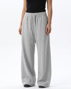 Women's light gray wide-leg sweatpants with drawstring waist and relaxed drape