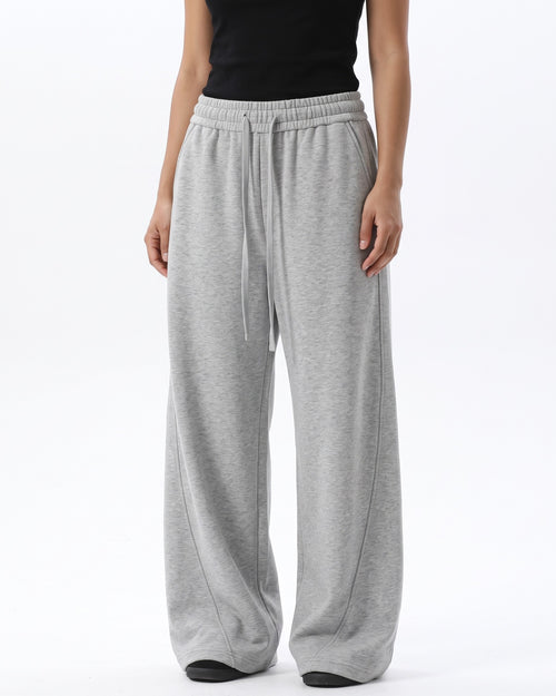 Women's light gray wide-leg sweatpants with drawstring waist and relaxed drape