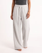 Women's light gray barrel-leg sweatpants with elastic waist and drawstring ties