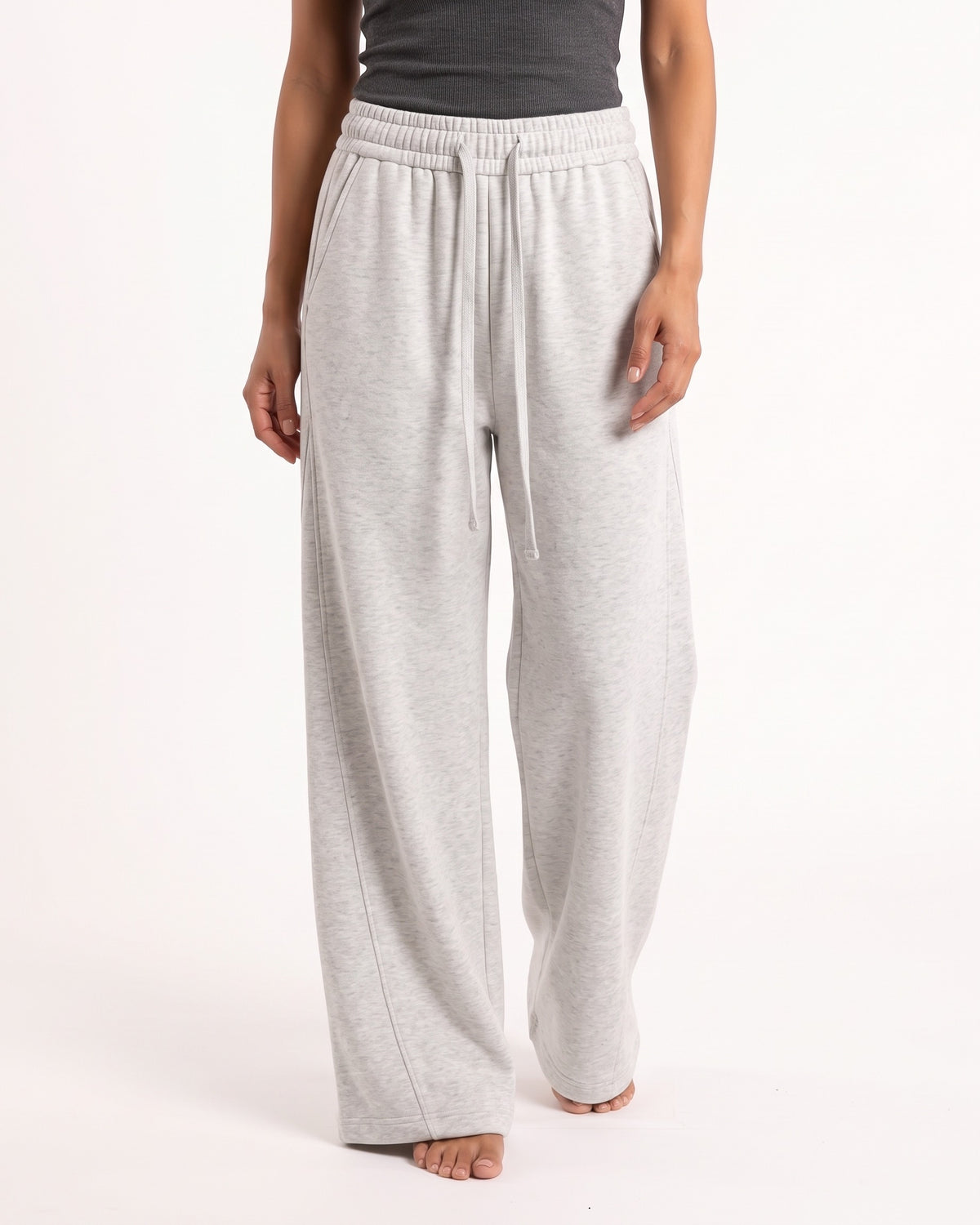 Women's light gray barrel-leg sweatpants with elastic waist and drawstring ties