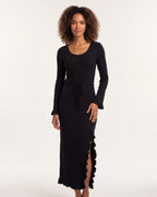 Black ribbed knit maxi dress with scoop neck, tie waist, bell sleeves, lettuce hem.