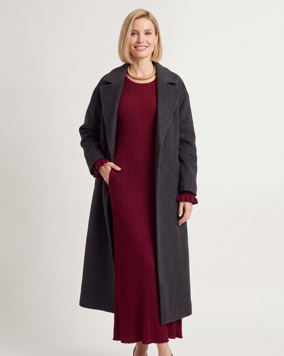Burgundy ribbed knit maxi dress with V-scoop neckline, tie waist, bell sleeves.