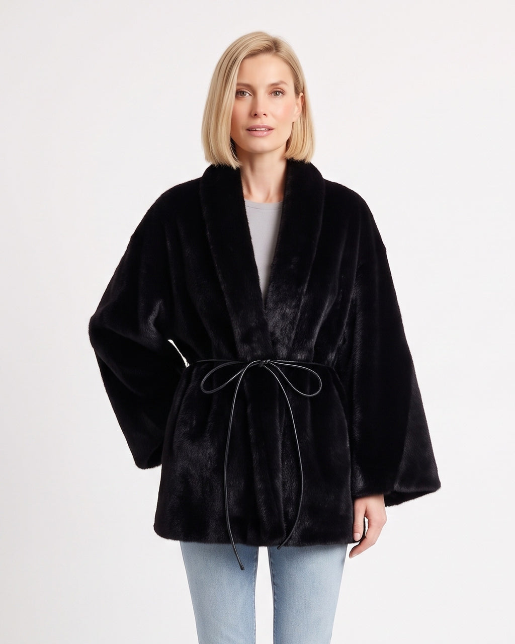 Women’s black faux fur wrap coat with shawl collar and tie belt