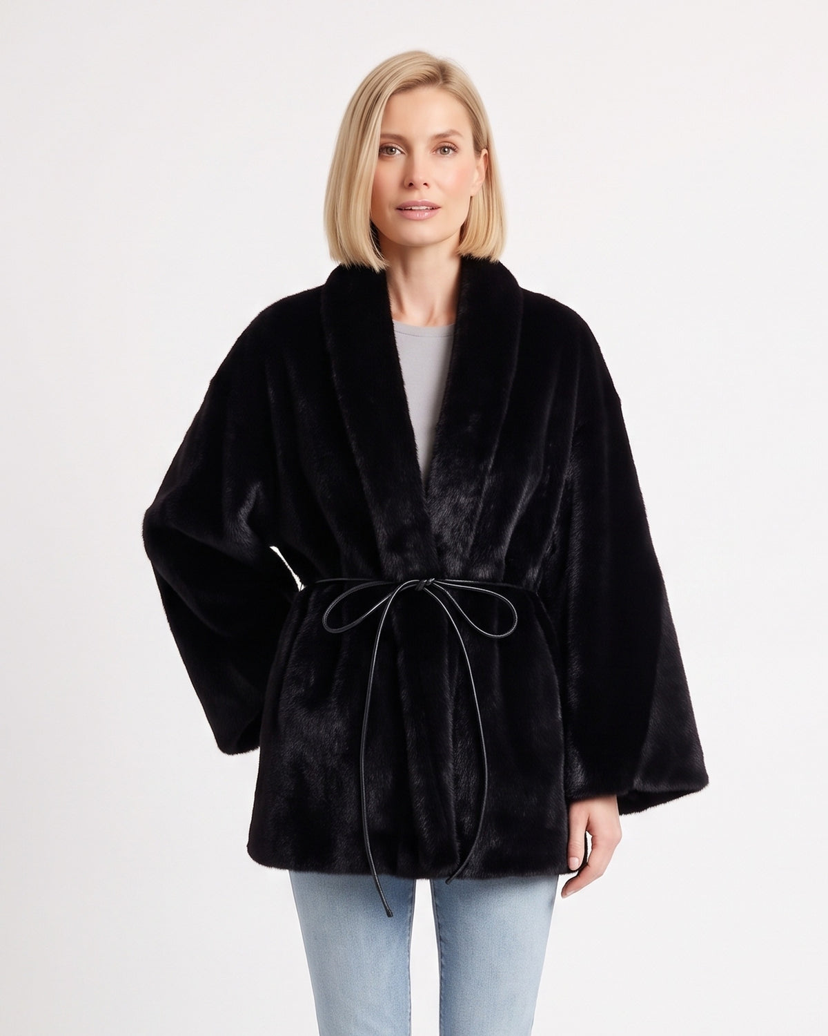 Women’s black faux fur wrap coat with shawl collar and tie belt