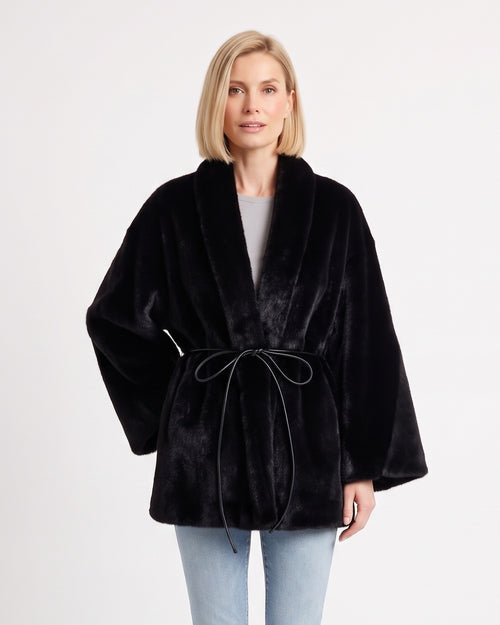 Women’s black faux fur wrap coat with shawl collar and tie belt