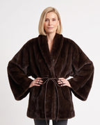 Women’s dark brown faux fur wrap coat with shawl collar and tie belt