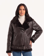 Women’s faux shearling aviator jacket, side view with belt, front zipper, and zip pockets