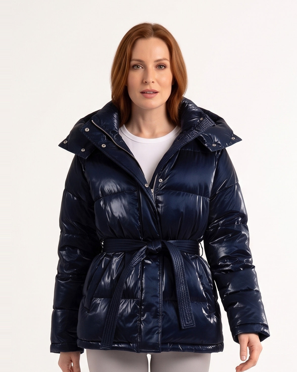 Dark blue glossy belted puffer jacket with hood, tie waist, long sleeves, zip front