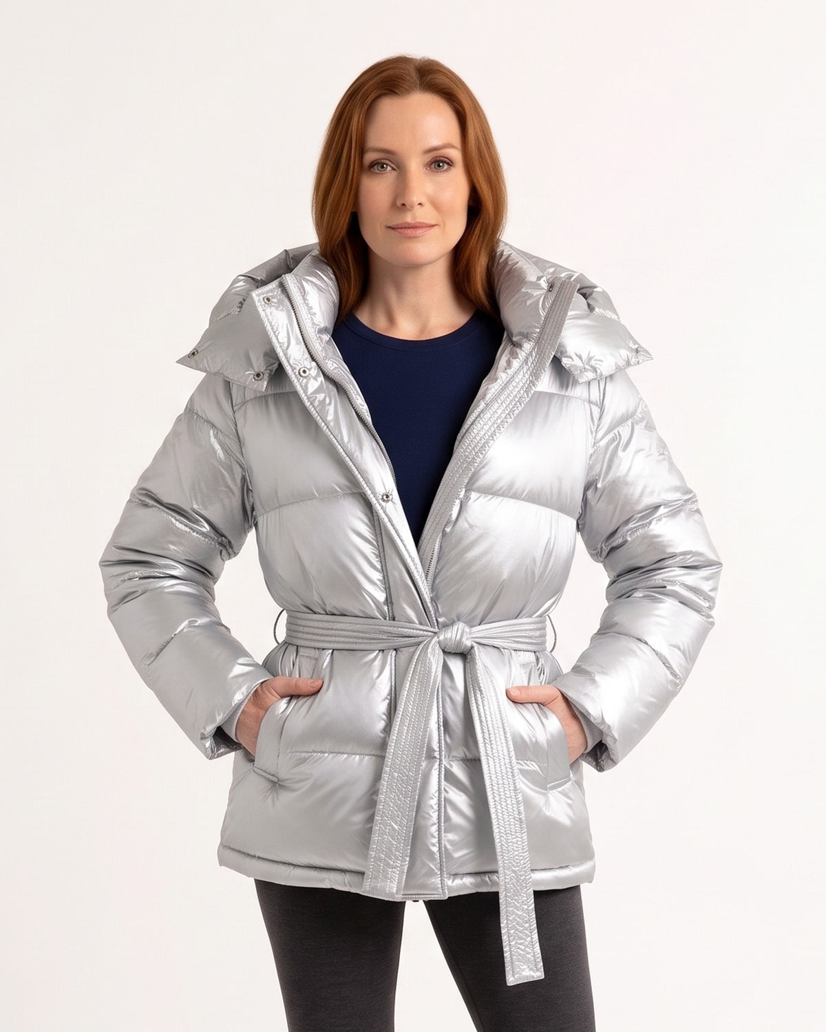 Women’s belted puffer jacket in glossy silver with oversized hood and tie waist