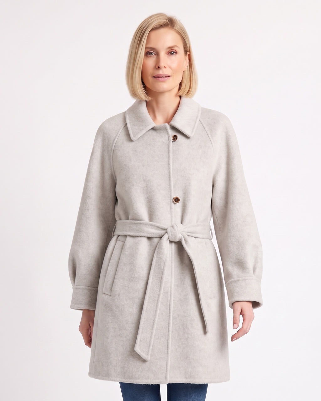 Women's off-white wool coat with raglan sleeves, single-breasted buttons, and a tied belt