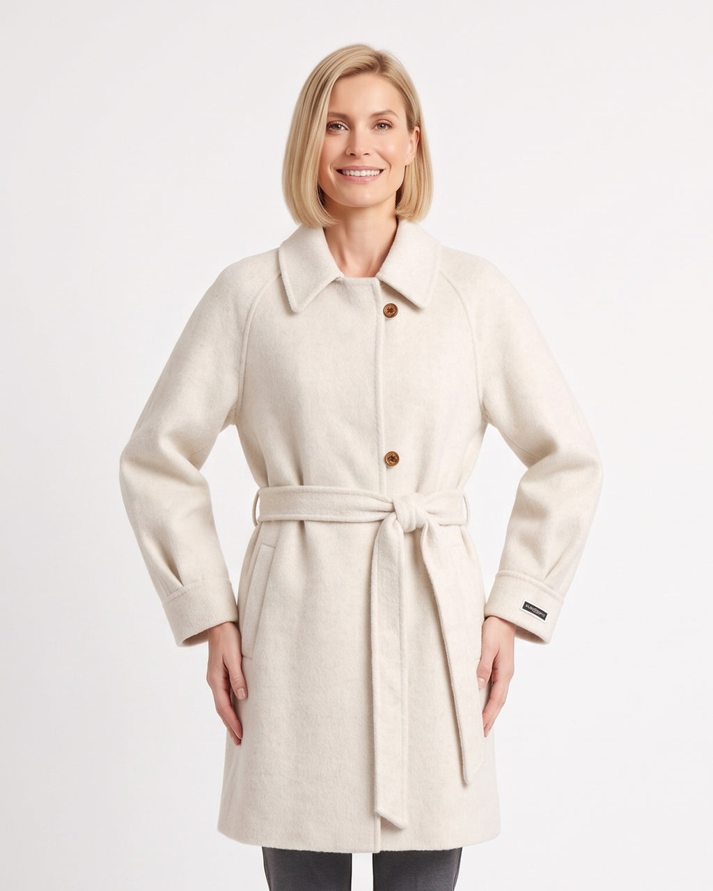 Off-white wool coat with a notched collar, button front, raglan sleeves and tied belt