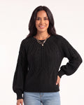 Black cable-knit sweater with a crew neck and balloon sleeves