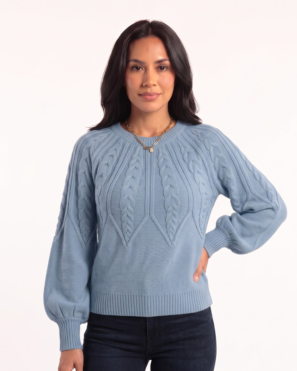 Light blue cable-knit sweater with crew neck, raglan seams, and balloon sleeves