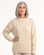 Cream cable-knit crew neck sweater with textured knit pattern and ribbed hem