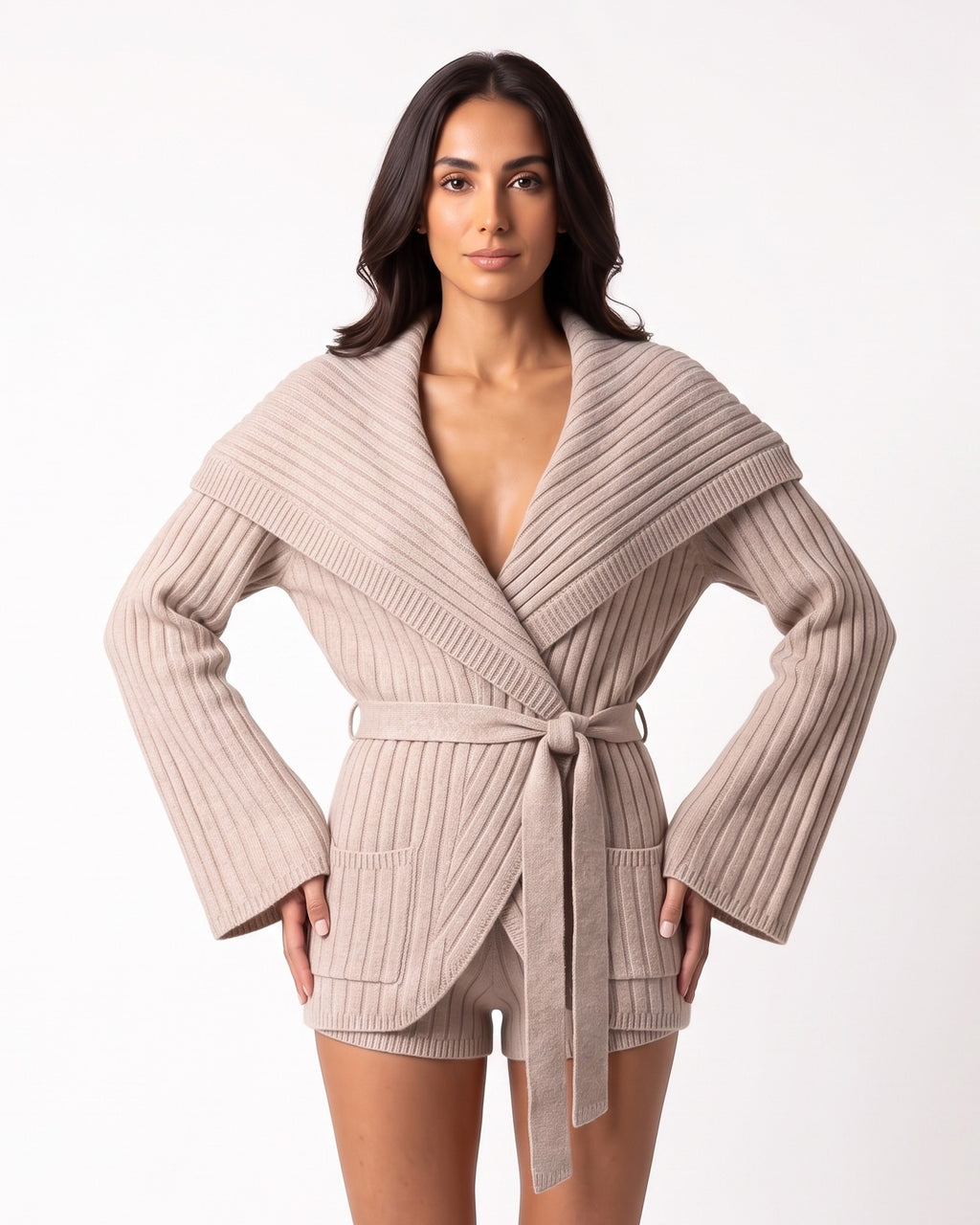 Beige ribbed knit cardigan with oversized shawl collar and matching tie-belt shorts