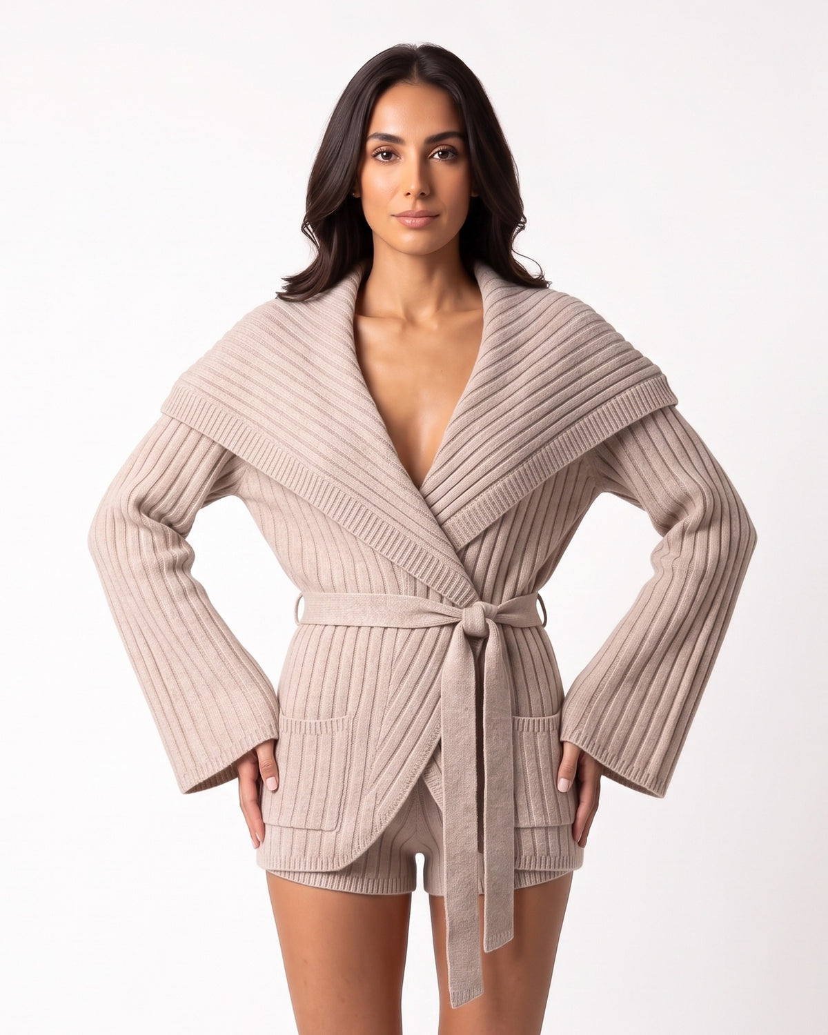 Beige ribbed knit cardigan with oversized shawl collar and matching tie-belt shorts