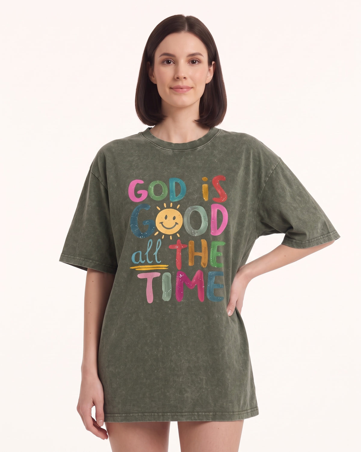 Women's oversized graphic T-shirt in army green with colorful 'God is Good' text