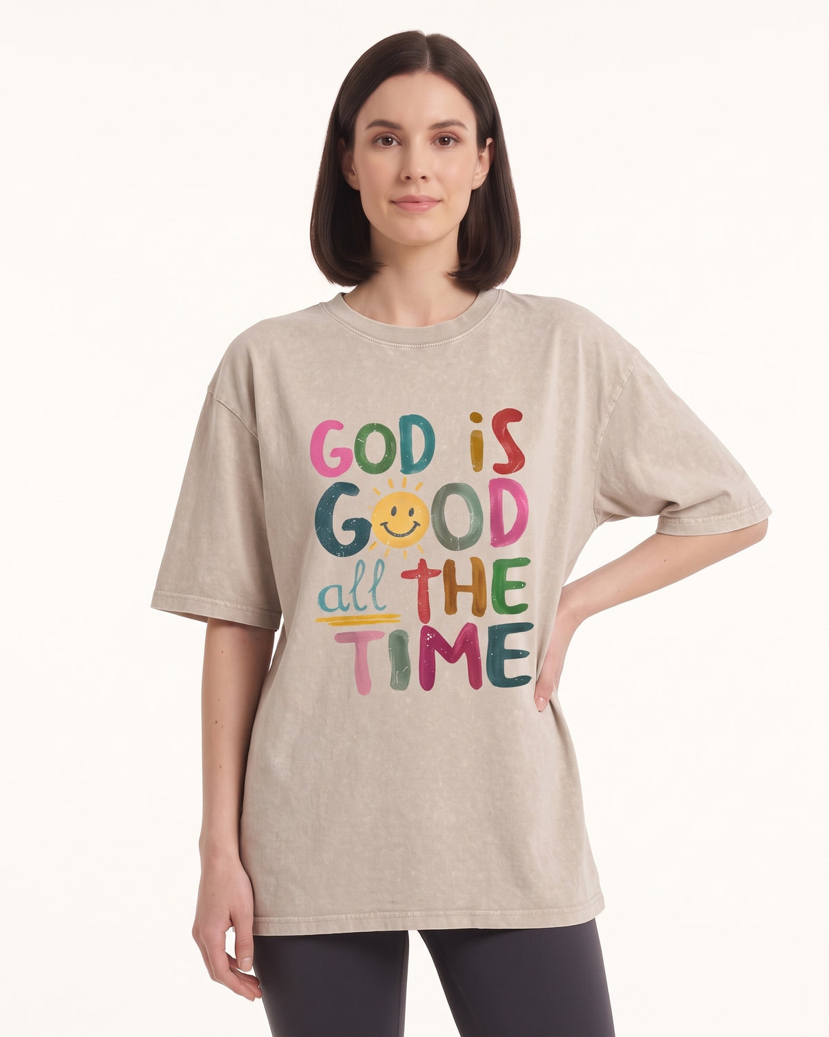 Women's oversized graphic T-shirt in light beige with colorful God is Good message