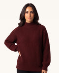 Burgundy women’s chunky knit mock neck pullover with ribbed hem and long sleeves