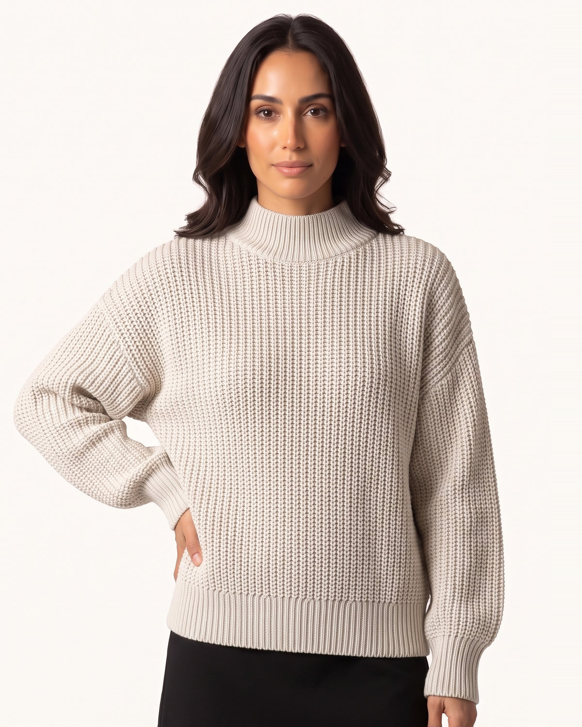 Off-white chunky knit mock neck sweater with oversized drop shoulders and ribbed cuffs