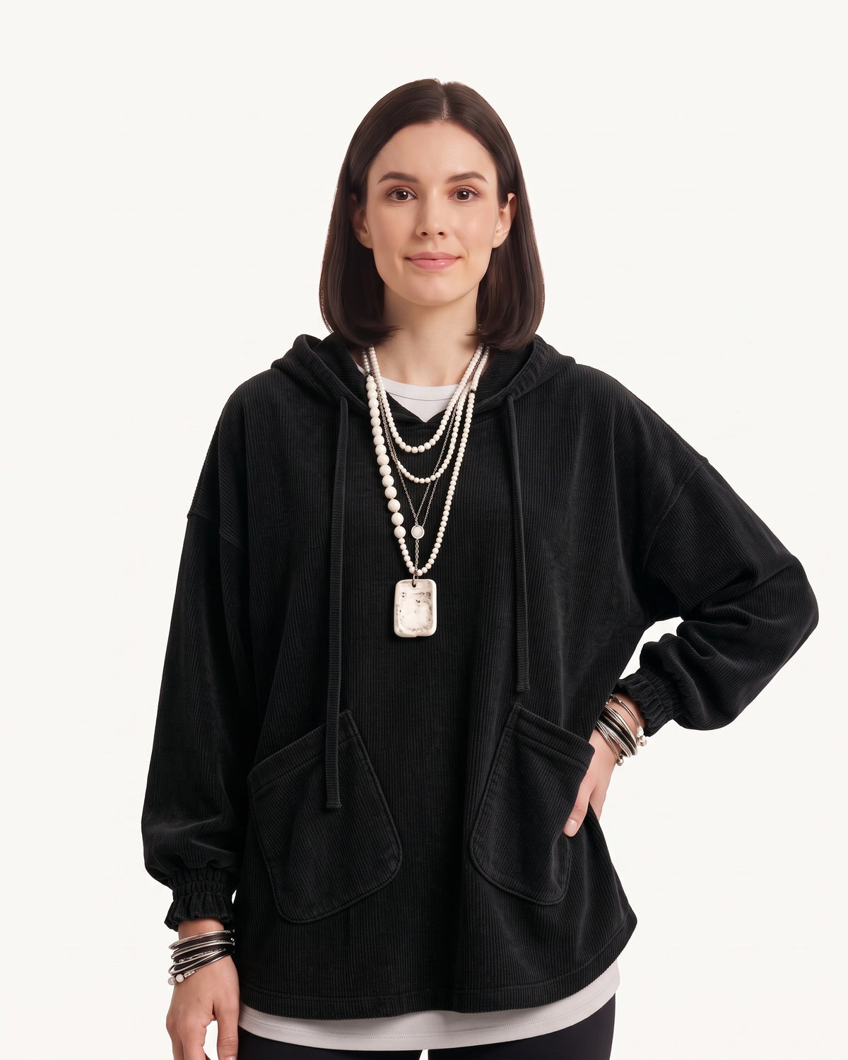 Black corduroy oversized hoodie with drawstring hood and patch front pockets