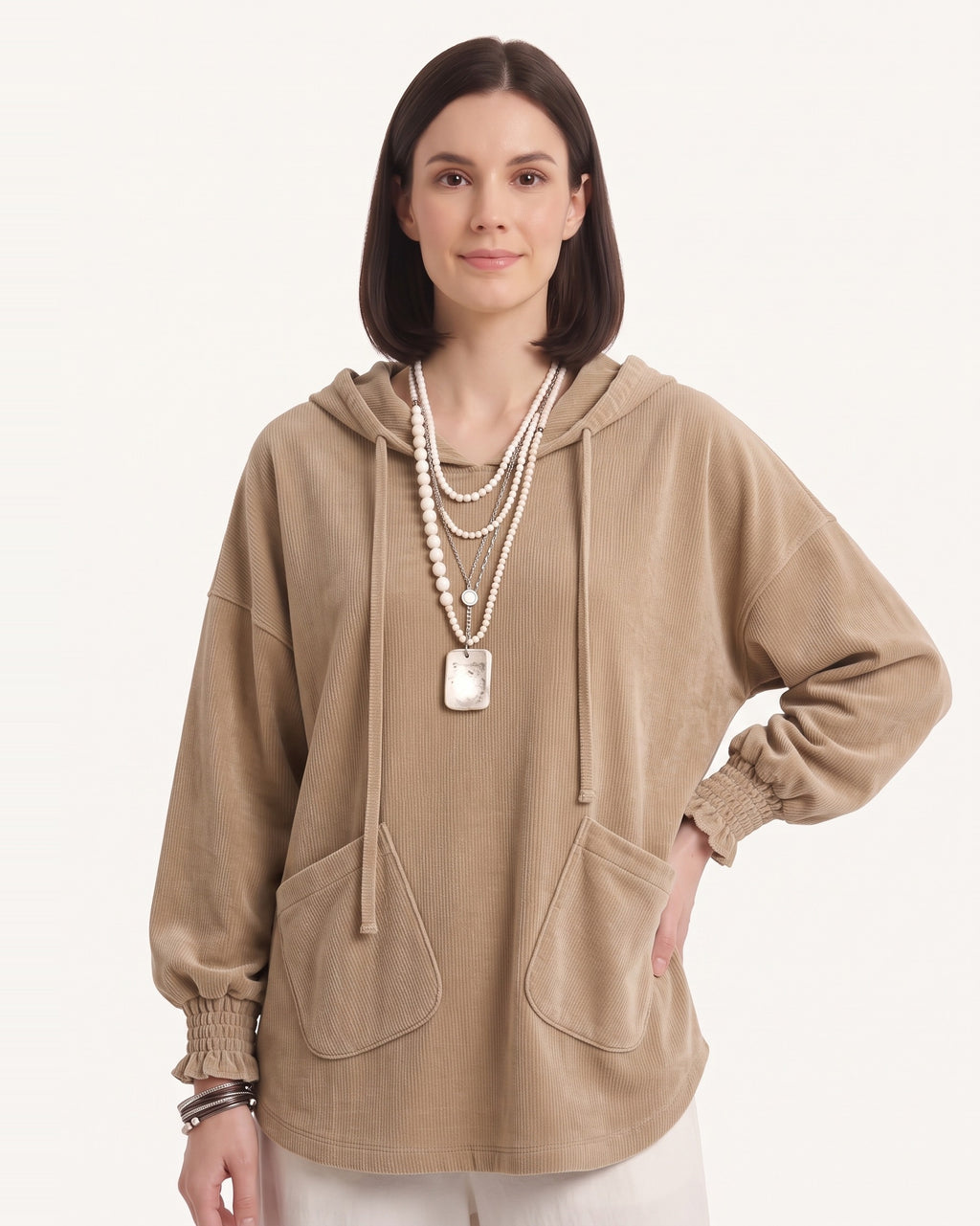 Tan corduroy oversized pullover hoodie with drawstring hood and patch pockets.