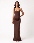 Brown scoop-neck corset maxi dress, sleeveless bodycon with draped ruching at hip.