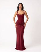 Burgundy scoop-neck corset maxi dress, sleeveless fitted gown with draped waist.