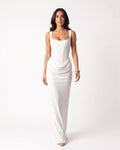 White scoop-neck corset maxi dress, sleeveless bodycon with draped waist ruching.