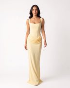 Yellow scoop-neck corset maxi dress, sleeveless bodycon with draped waist ruching.