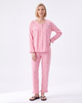 Pink floral print pajama set with long-sleeve button-front top and tapered pants