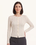 Off-white floral pointelle cardigan for women with button front and scalloped crew neckline