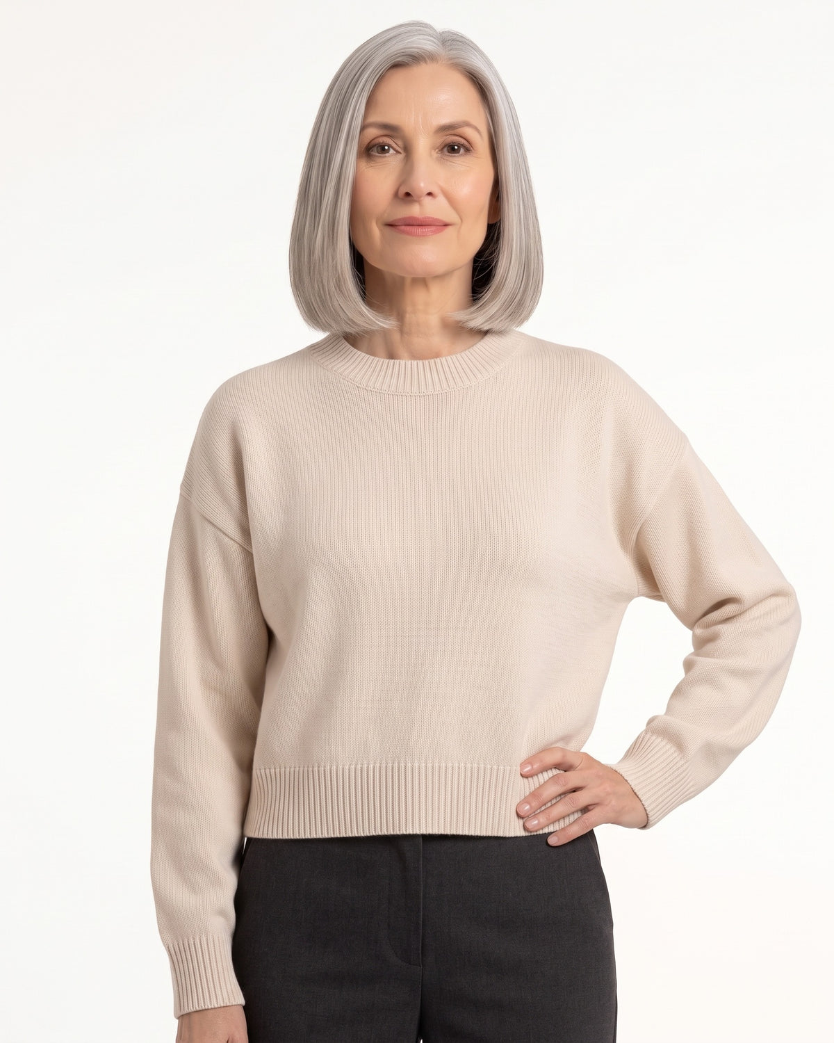Women’s light beige crew neck knit sweater with ribbed hem and cuffs, oversized boxy fit