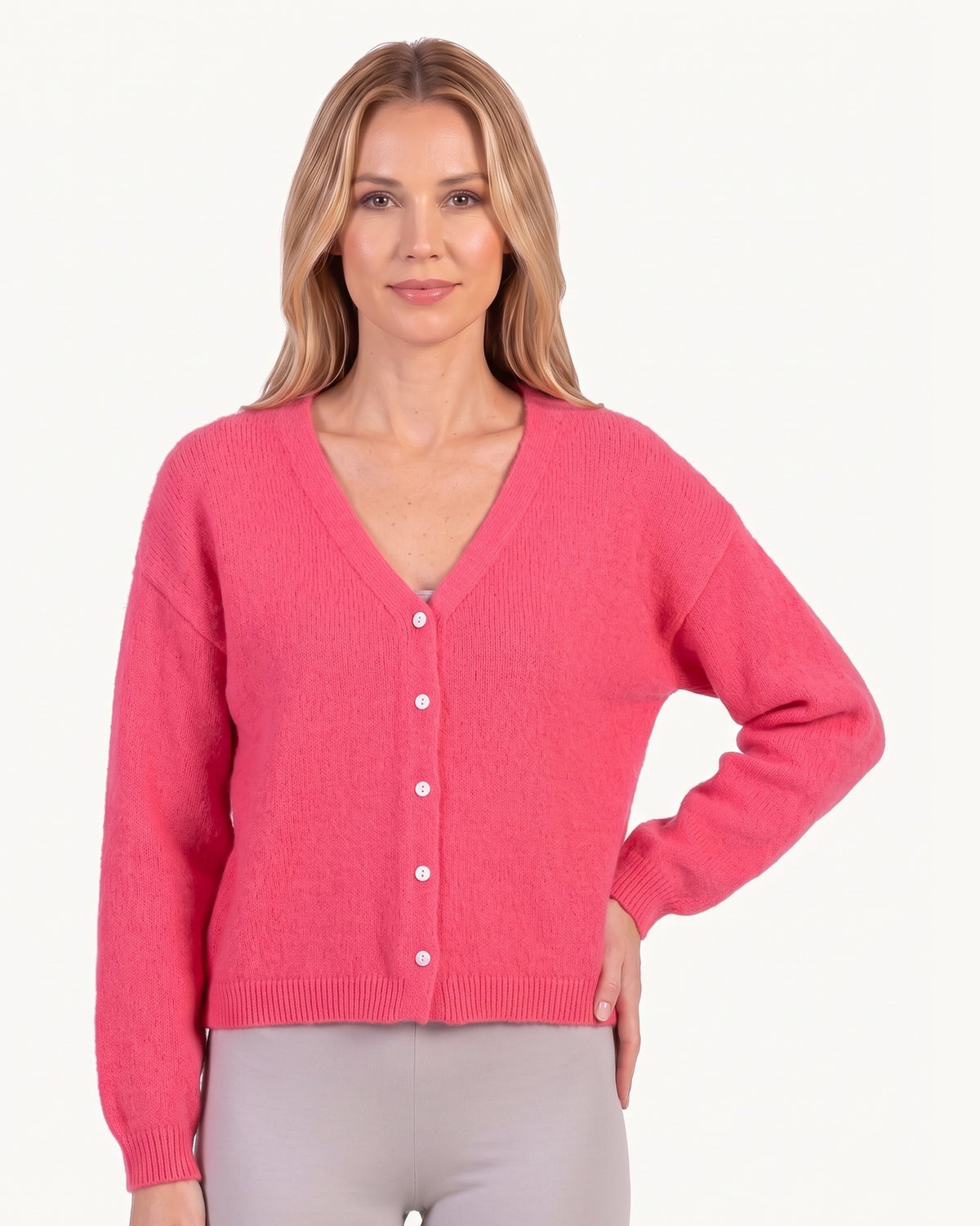 Pink cropped knit cardigan with V-neck button front, long sleeves and ribbed hem