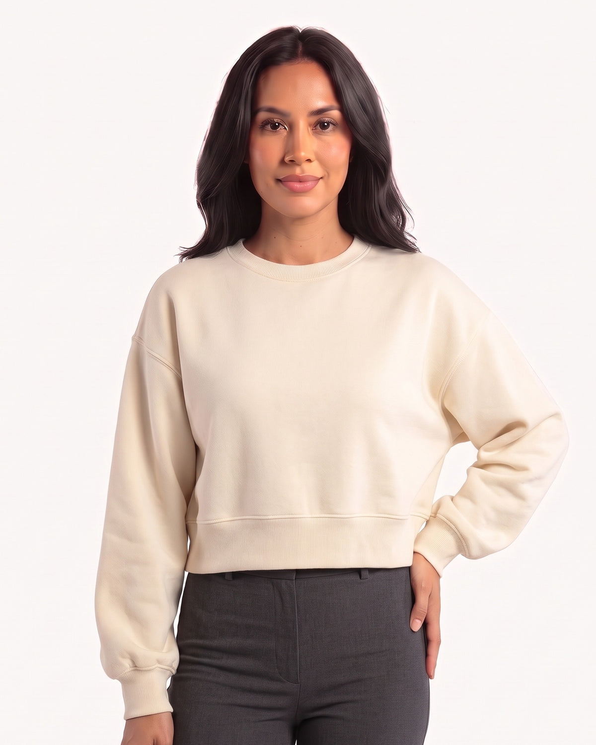 Cream cropped crewneck pullover with long sleeves and ribbed hem