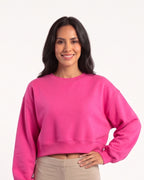 Hot pink cropped crewneck pullover with oversized long sleeves