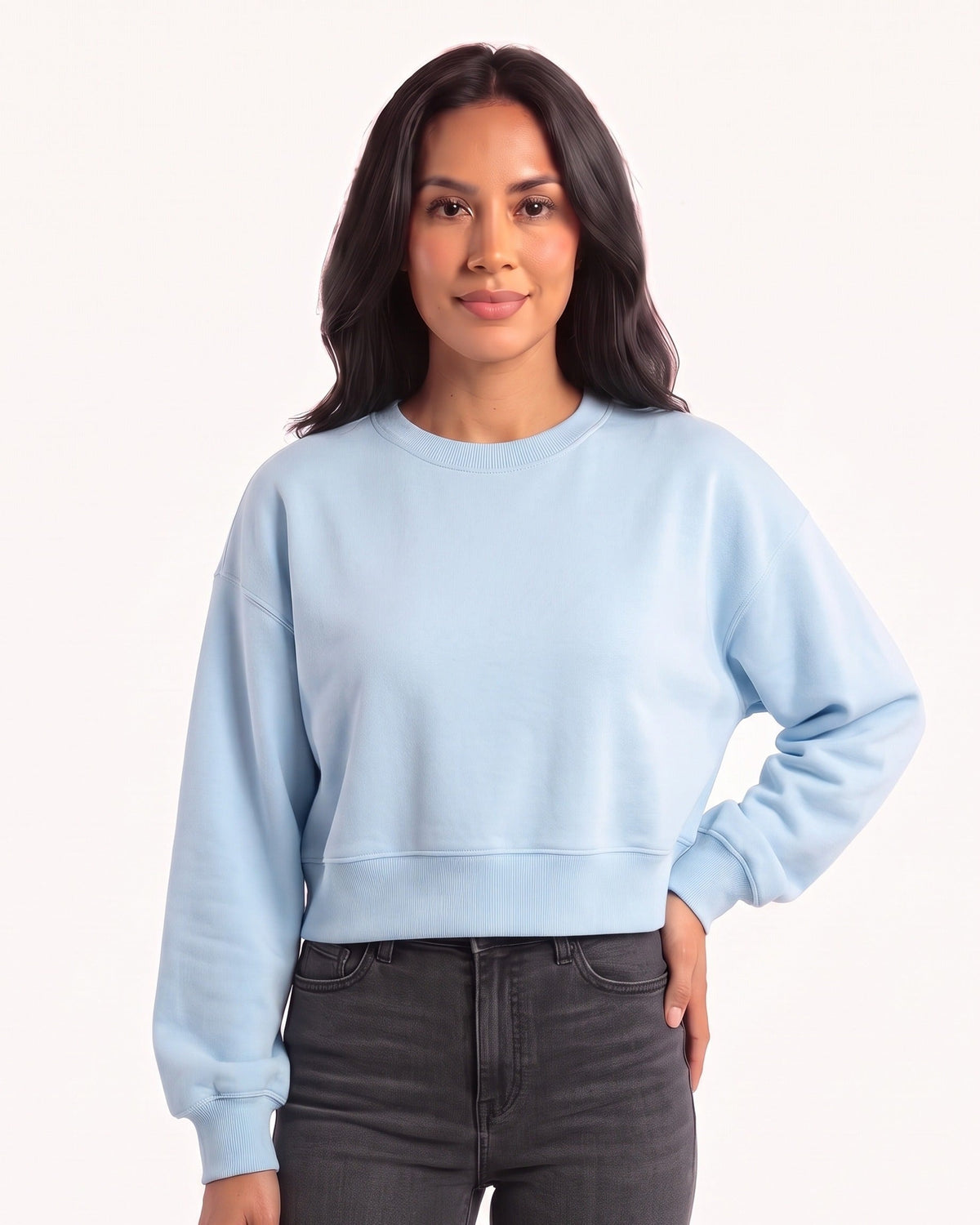 Cropped light blue crewneck sweatshirt with an oversized fit, long sleeves, and ribbed cuffs and hem