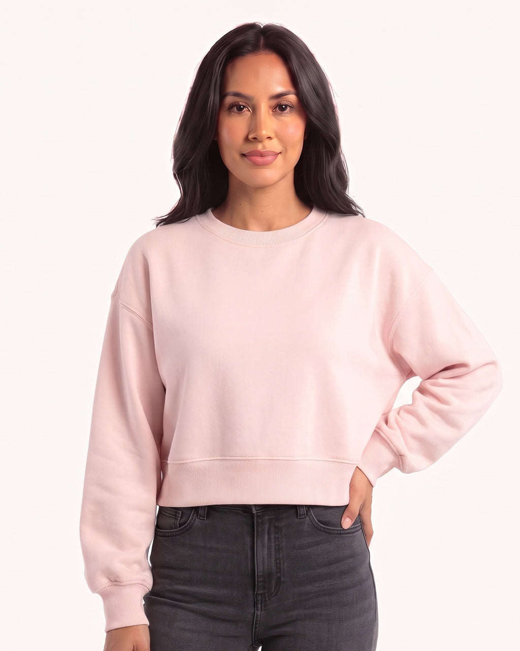 Light pink cropped sweatshirt with a crew neck, oversized fit, and ribbed hem